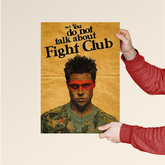 First Rule of Fight Club wall art poster held by person wearing red sleeves featuring stylized portrait and quote