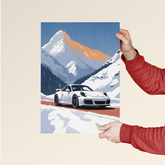 Porsche 911 winter poster by Dripster showing white Porsche 911 driving on a snowy mountain road