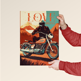 Person holding Dripster premium bike posters India featuring vintage motorcycle rider in scenic mountain background